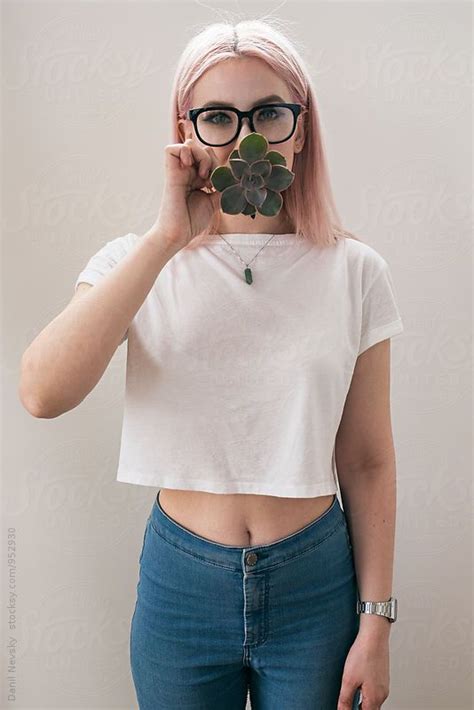 Blonde Woman Covering Mouth With Succulent By Stocksy Contributor Danil Nevsky Blonde