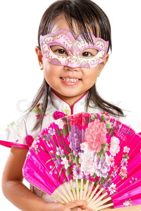 Asian Little Chinese Girl Wearing Mask And Holding Oriental Fan Stock