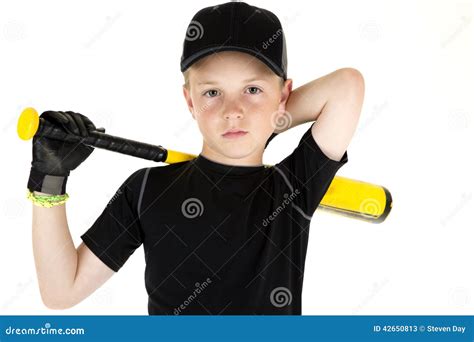 Young Boy Baseball Player Holding His Bat With A Serious Express Stock
