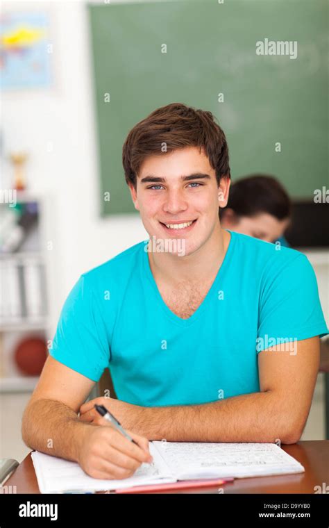 Handsome High School Student Writing Classwork Stock Photo Alamy