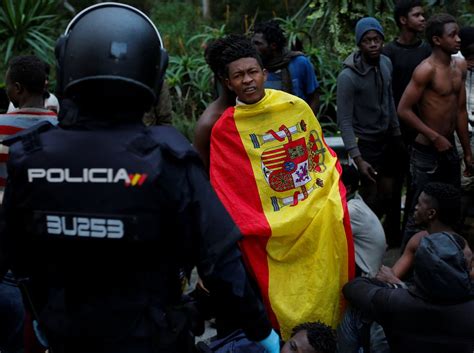 Bordered by morocco, it lies along the boundary between the mediterranean sea and the atlantic ocean. Hundreds of migrants scale 20ft fence into Spanish enclave ...