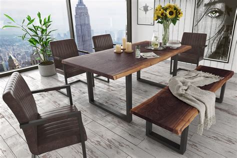 Combining traditional charm with a modern twist, each of these generous frames are strong enough to support gaming, studying and most importantly dining for the whole household. Modrest Taylor Modern Live Edge Wood Dining Table