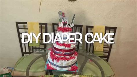 Ideal diaper cake inspiration if you are going to gift only the baby bibs and diapers and also a few toys! DIY Diaper Cake - YouTube