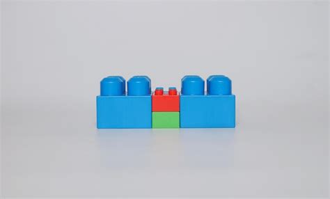 premium photo close up of multi colored plastic blocks over white background