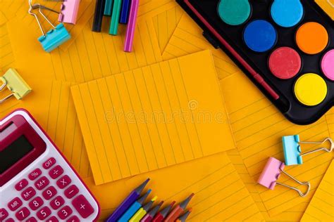 School Office Supplies Stationery On A Orange Paper Background With