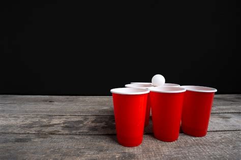 Premium Photo Game Beer Pong On Wooden Table