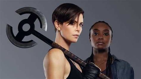 the old guard character and motion posters offer new details on charlize theron s immortal team