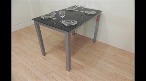 Compra mesa & cocina en nuestra tienda de moda online dafiti! Mesa de cocina de cristal negro con base metálica de ...