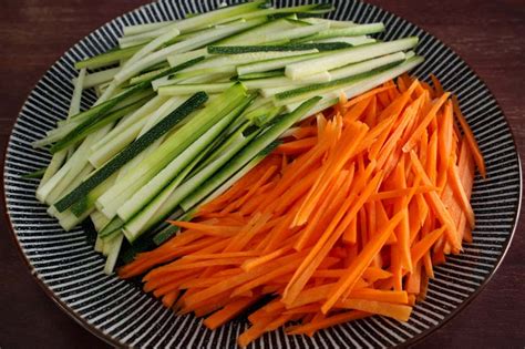 Peel the carrots and cut into 8cm lengths. Courgette and Carrot Salad with Peanut Dressing | The Pesky Vegan