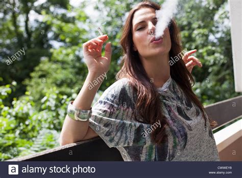 Woman Smoking On Balcony Outdoors Stock Photo Royalty Free Image