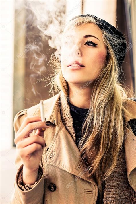 Woman Smoking A Cigarette — Stock Photo © Maurogrigollo 76945543