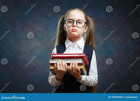 Serious Schoolgirl Wear Glasses Hold Pile Of Book Stock Image Image