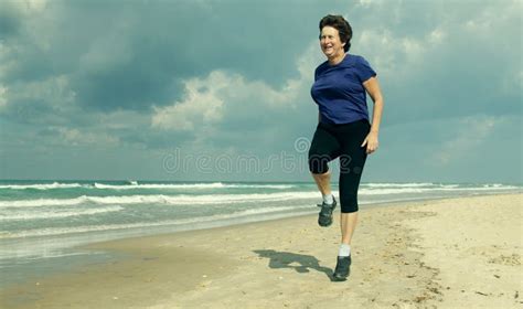 Senior Woman Running On The Beach Stock Image Image Of Copy Casual