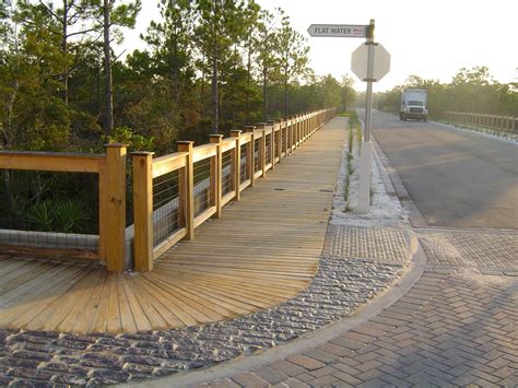 Nature Bridges Built This Wooden Sidewalk With Decorative Handrail In