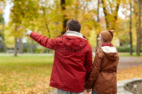 Happy Young Couple Walking In Autumn Park Stock Image Image Of Happy