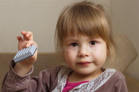 Little Girl Holding A Toy Stock Photo Image Of Girl 67001810