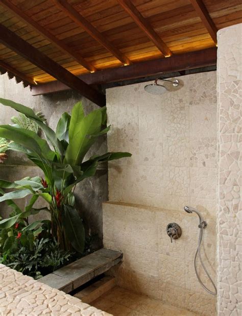 This simple yet elegant rainfall shower. Semi-outdoor shower | Tropical bathroom decor, Outdoor ...