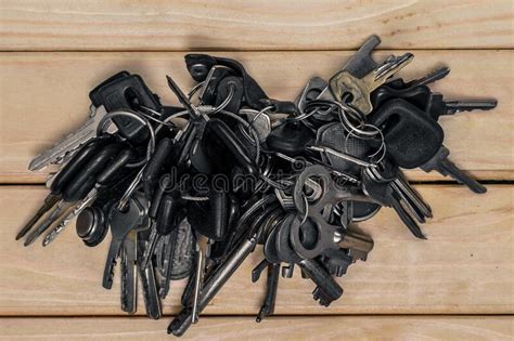 A Set Of Different Antique Keys On The Table In A Bunch Stock Photo