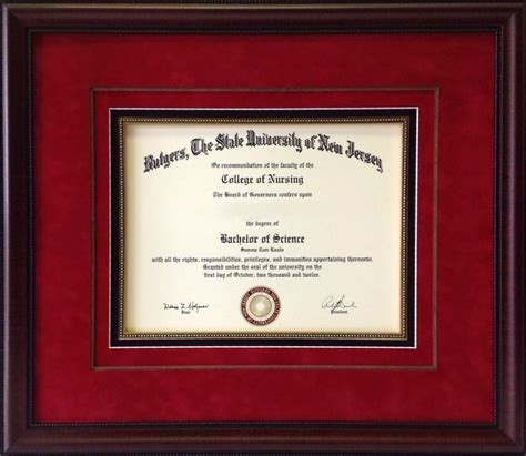 A Diploma Framed In Red And Gold