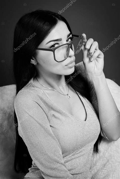 Portrait Of Young Pretty Lady In Glasses Relaxing Sitting On Chair And