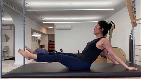 Pilates Hip Twist With Stretched Arms With A Ball Youtube