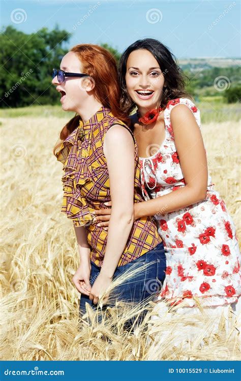 Two Girls Laughing In Wheat Field Stock Image Image Of Lesbians Blue 10015529