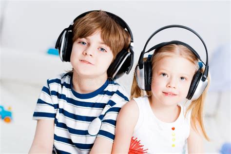 Brother And Sister Listening Music With Headphones Stock Image Image