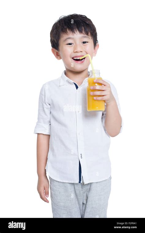 Happy Boy Drinking Juice Stock Photo Alamy