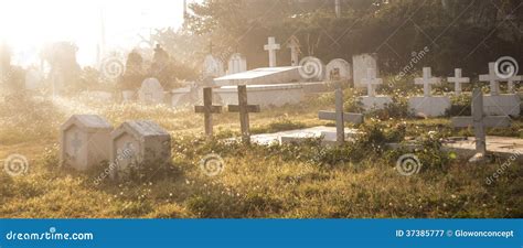 Old Cemetery Graveyard Grave Tombstone Broken And Ruin Covered In Grass