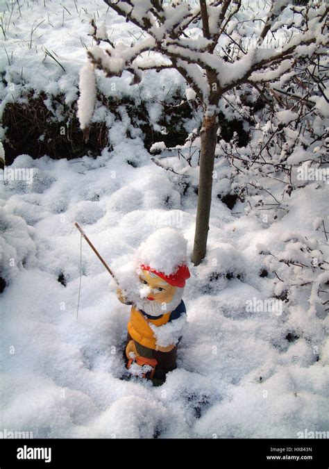 Fishing Gnome Covered In Snow Stock Photo Alamy