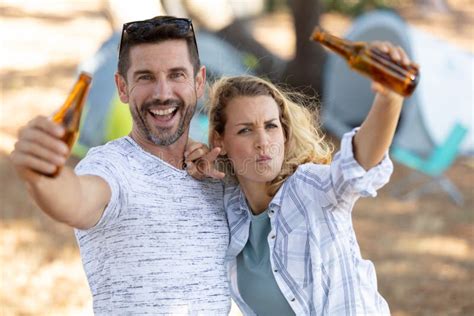 Young Couple Drinking Beer While Camping Stock Photo Image Of Autumn