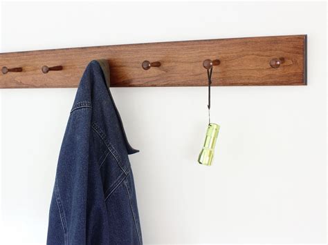 It's drilled for mounting and comes complete with screws, wall anchors. Solid Cherry Shaker Peg Racks - Handcrafted in the USA