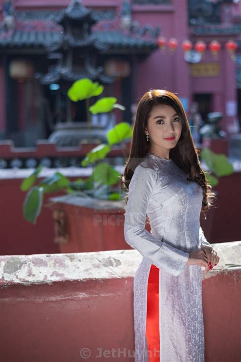 Vietnamese Girl Wearing Ao Dai Praying In Pagoda License Download Or Print For £2480