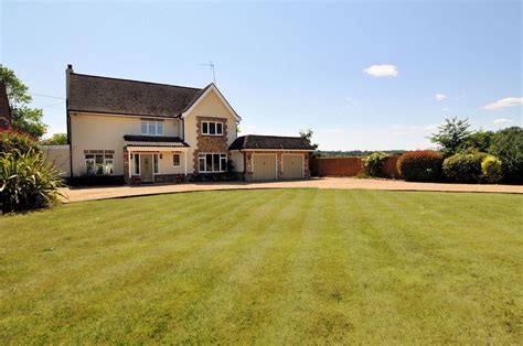 Surrounded by open fields is the perfect setting for this truly