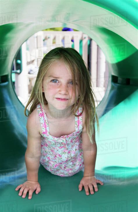 Portrait Of A Babe Girl On Playground Equipment Salmon Arm British Columbia Canada Stock
