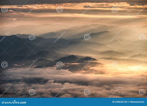 Sunrise Shining On Layers Mountain With Foggy In The Valley At National