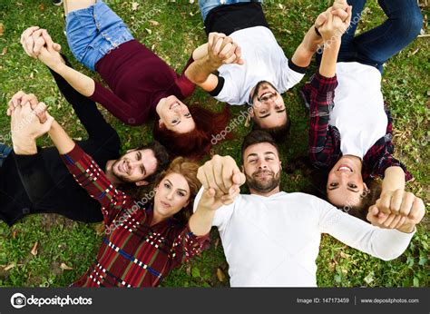 Group Of Young People Together Outdoors In Urban Background Stock Photo