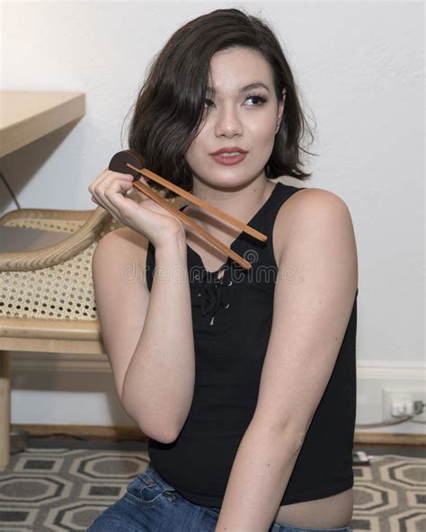 Beautiful Amerasian 19 Year Old Girl Beginner Chopsticks Stock Photos