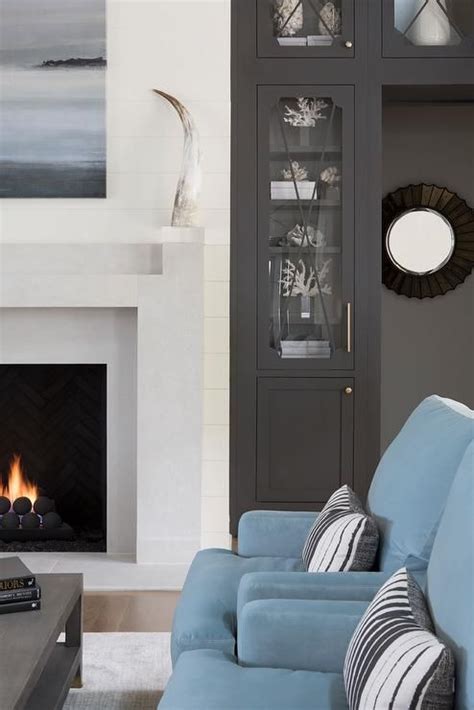 It's possible to replicate this look even if you don't have a fireplace. A blue art piece hangs above a light gray fireplace mantel ...