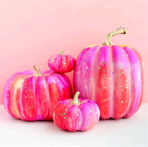 Download Three Pink And Gold Painted Pumpkins On A Pink Background