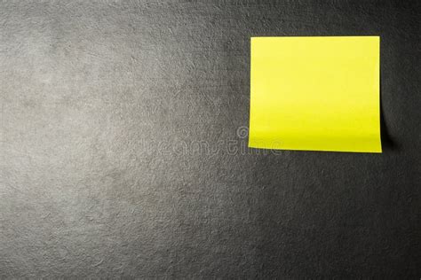 Yellow Note Paper Or Sticky Note On Blackboard Texture Stock Image