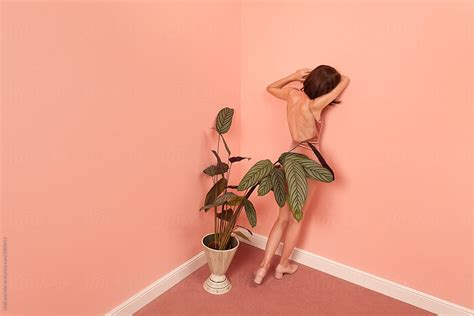 Fashionable Woman Leaning Against A Pink Wall By Stocksy Contributor Ulas Merve Stocksy