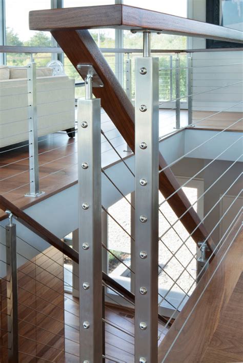 It's mounted at the top and bottom of each staircase with floating wooden steps. Staircases - Gallery Kitchen Design