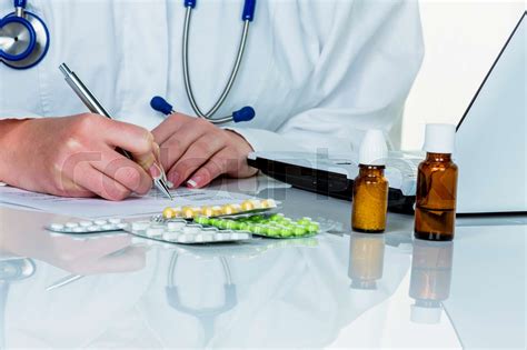 doctor prescribes a drug stock image colourbox