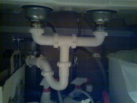 The part used for tieing the drains together is a slip joint dishwasher drain enters just below the sink followed by a p trap. Plumbing A Double Kitchen Sink With Dishwasher | MyCoffeepot.Org