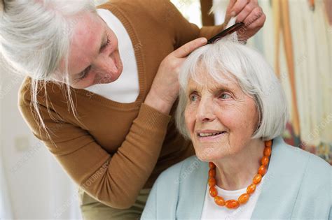 Woman Helping Elderly Woman Stock Image C0325503 Science Photo Library