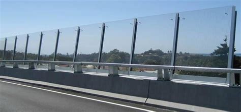 Acrylic Sound Barrier Installed Along A Highway Which Crosses The