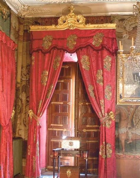 Two Pairs Of Spanish Red Silk Damask Curtains With Giltwood Pelmets