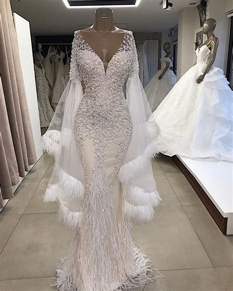 Plunging Neck Sparkly Evening Gown With Feather Bridal Dresses Stunning Wedding Dresses
