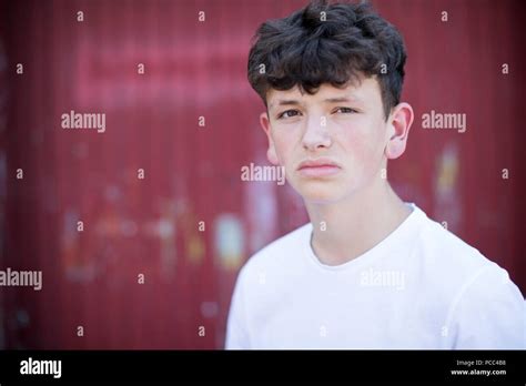 Head And Shoulders Portrait Of Serious Teenage Boy Stock Photo Alamy